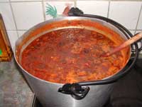 Red Tomato Chutney near  the boil