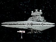 The lego model of the Impirial star destroyer, with a minnie model blockade runner